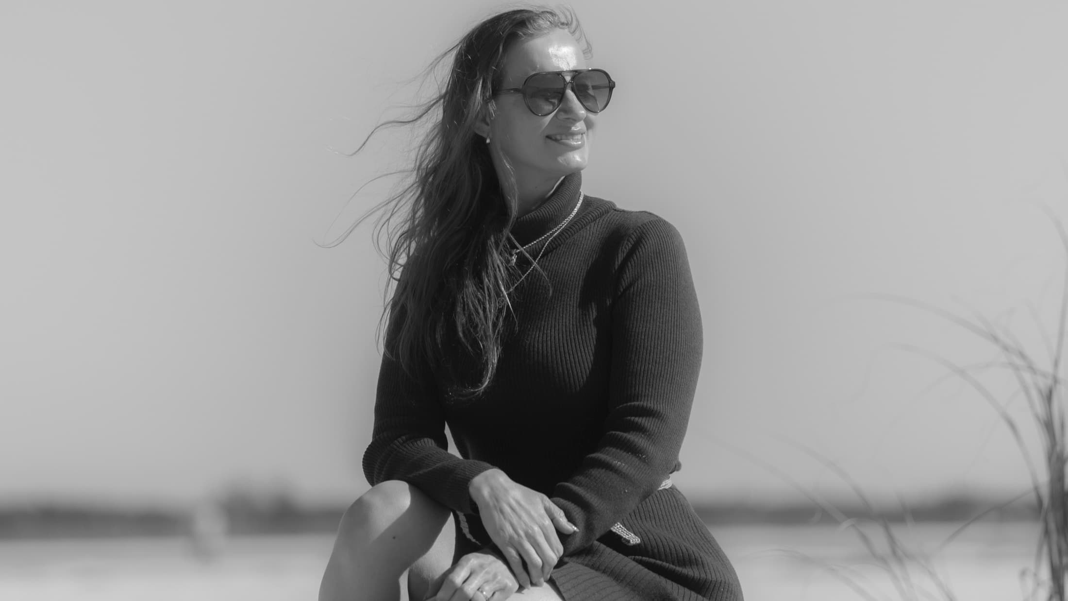 Portrait session client smiling on the beach